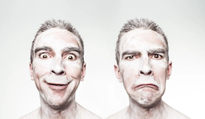 2 guys with very different emotional faces
