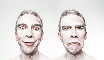 2 guys with very different emotional faces